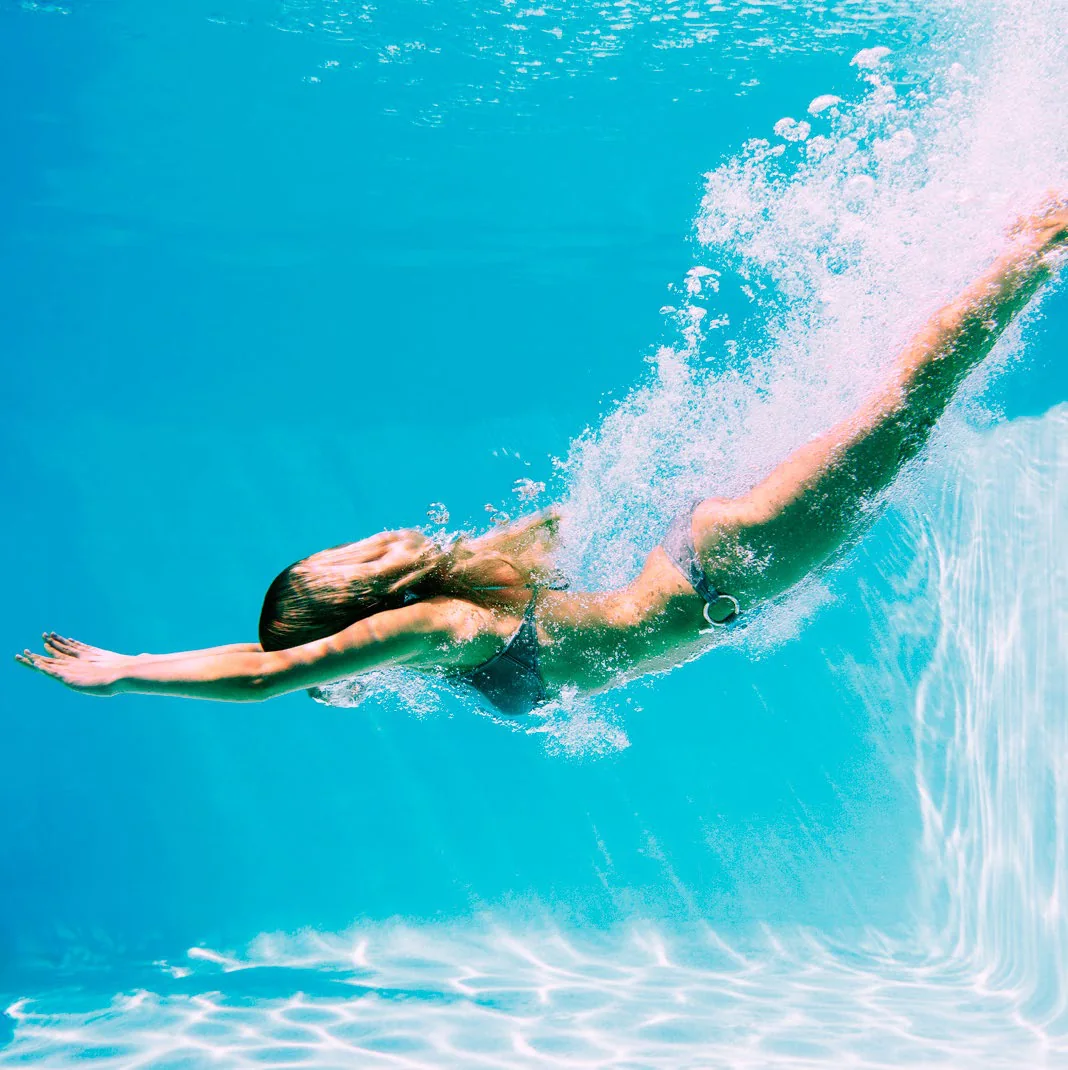 Swimmer underwater in a pool